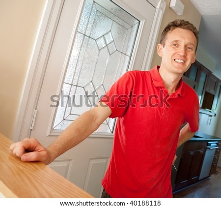 Man at new house door