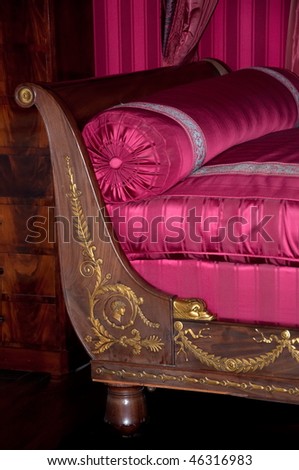 Detail of an old luxury royal vintage sofa. Old-fashioned interior detail in medieval royal castle Amboise, Loire Valley, France,  Europe