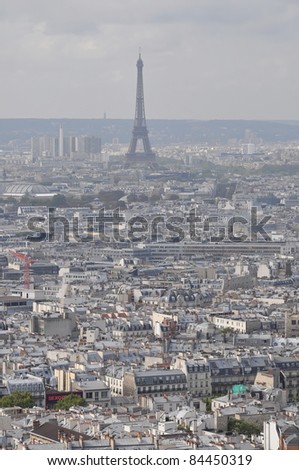 Paris skyline: Eiffel Tower from across Paris rooftops.