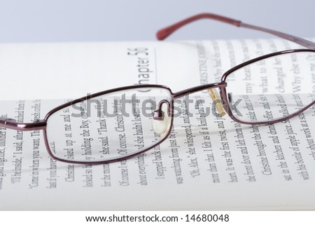 Eyeglasses on a typed page in book, macro