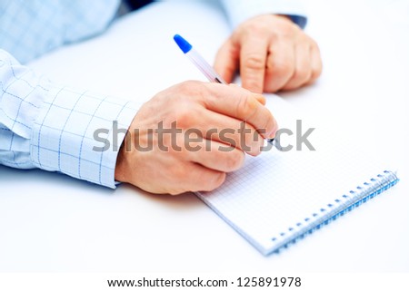 Image of businessman hand writing