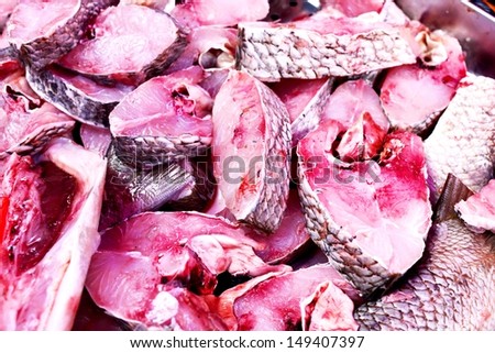 The big pieces of red fish with blood in the fish market
