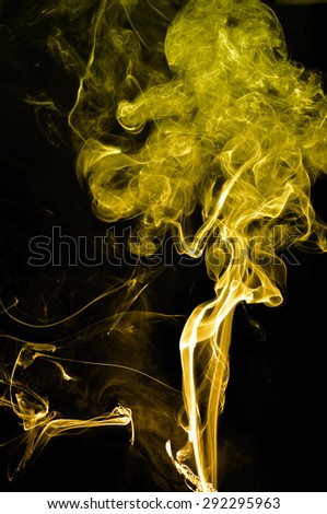 Abstract gold smoke on black background, gold background,gold ink background
