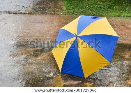 umbrella on the floor wet after rain