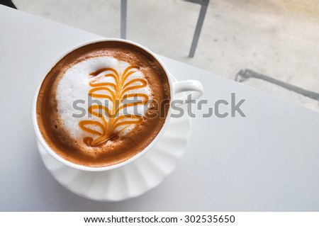 A Cup of Cappuccino with Froth, A Cup of Cappuccino with Froth in coffee shop