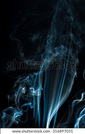 movement of  smoke Abstract white and blue smoke on black background, white and blue smoke background,Light blue ink background,blue fire