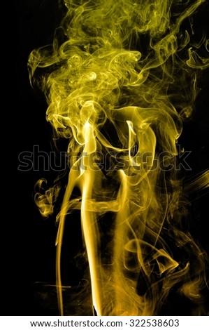 movement of yellow smoke, Abstract gold smoke on black background, gold background,gold ink background