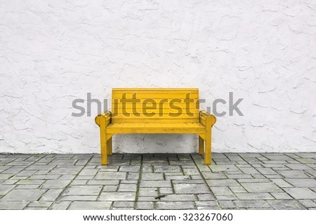 yellow chair on white background,yellow chair wooden on white wall