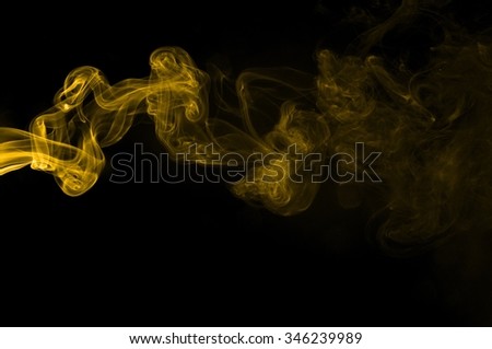 Gold smoke on black background,movement of gold smoke, Abstract gold smoke on black background, gold background,gold ink background,yellow smoke,Glittering gold smoke tail
