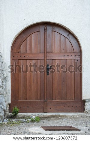 Typical round door made of wood in slovenia, europe