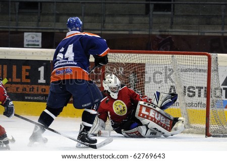 ZELL AM SEE, AUSTRIA - SEPTEMBER 30: Austrian Icehockey Classic Tournament. Action in front of Goalie Hochwimmer. Game Zell am See Oldies vs. Pallojussit (Result 3-3) September 30, 2010 in Zell am See, Austria.