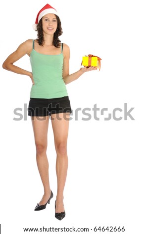 Very sexy young woman in hot pants standing with christmas present in her hand and santa hat. Isolated on white background.