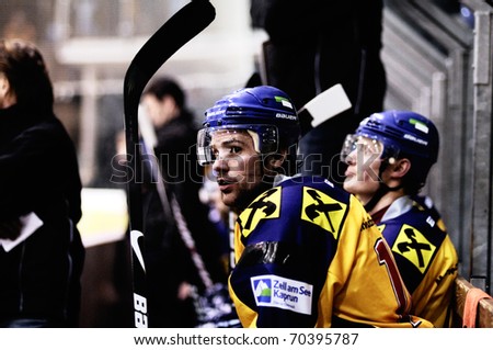 ZELL AM SEE, AUSTRIA - FEB 1: Austrian National League. Lainer and Wurzer on Zell am See bench. Game EK Zell am See vs. ATSE Graz (Result 4-1) on February 1, 2011, at hockey rink of Zell am See