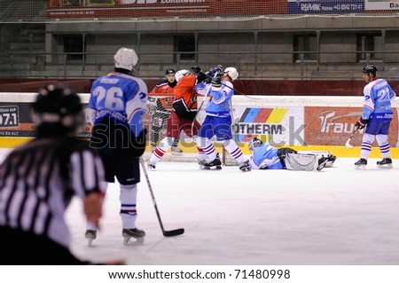 ZELL AM SEE, AUSTRIA - FEB 13: Salzburg hockey League. Fight between Enzenbrunner and Morzg player. Game SV Schuttdorf vs HCS Morzg  (Result 9-3) on February 13, 2011 at the hockey rink of Zell am See
