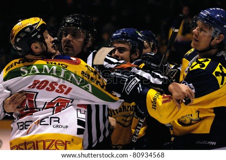 ZELL AM SEE, AUSTRIA - FEB 22: Austrian National League. Suorsa and Rossi in a brawl after the game. EK Zell am See vs. VEU Feldkirch (Result 3-1) on February 22, 2011 at hockey rink of Zell am See