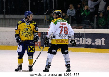 ZELL AM SEE, AUSTRIA - FEB 22: Austrian National League. Remi Royer instigating fight. Game EK Zell am See vs. VEU Feldkirch (Result 3-1) on February 22, 2011 at hockey rink of Zell am See