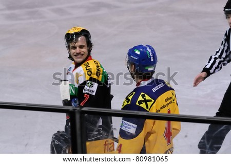 ZELL AM SEE, AUSTRIA - FEB 22: Austrian National League. Players on the way to the penalty box. Game EK Zell am See vs. VEU Feldkirch (Result 3-1) on February 22, 2011 at hockey rink of Zell am See