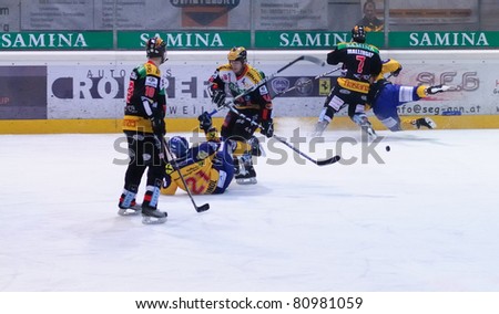 ZELL AM SEE, AUSTRIA - FEB 22: Austrian National League. Game gets chippy as score is out of hand. Game EK Zell am See vs. VEU Feldkirch (Result 3-1) on February 22, 2011 at hockey rink Zell am See