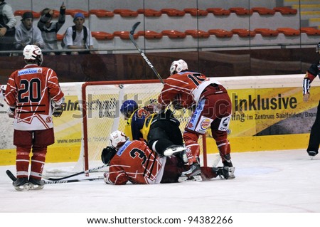 ZELL AM SEE; AUSTRIA - AUG 30: Austrian National League. Players of KAC II are protecting their goalie. Game EK Zell am See vs KAC II (Result 2-3) on August 30, 2011 in Zell am See.