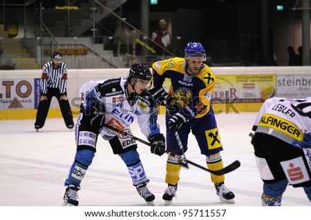 ZELL AM SEE; AUSTRIA - OCT 01: Austrian National League. Face off on the blue line of EKZ. Game EK Zell am See vs Linz II (Result 5-2) on October 01, 2011 in Zell am See.