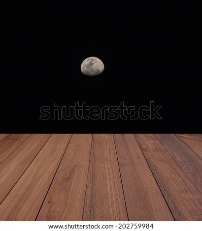 wood floor with moon on night sky
