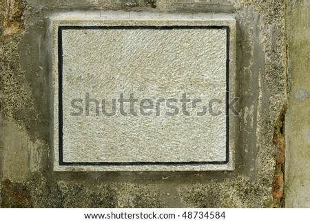 stone sign board on wall