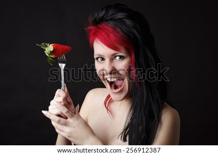Crazy red hair woman with strawberry
