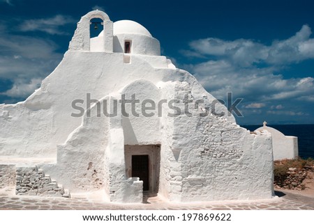Old Paraportiani 14 century church in the clouds - the most famous and popular place on the island Mikonos in Greece