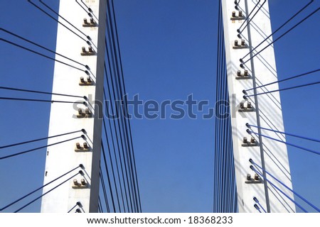 The cable stayed bridge supporting columns and suspension cable under the blue sky.