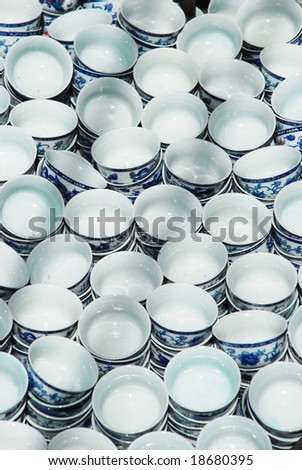 The Chinese small round porcelain tea cups with blue flower patterns.