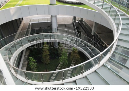 The spiral stair case in a modern building compound of steel and glass structure.