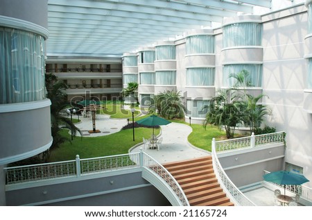stock-photo-the-indoor-hotel-lobby-garden-21165724.jpg