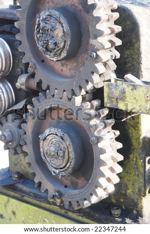 The gear wheels of a machine.