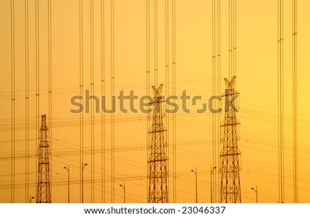 The electricity grid in the sunrise rosy sky.