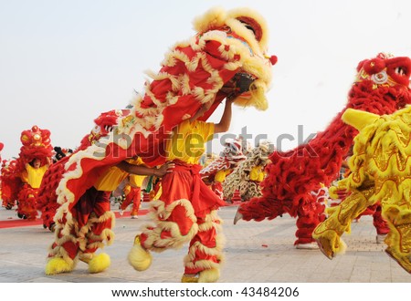 Chinese people playing lion dance celebrating the coming new year.