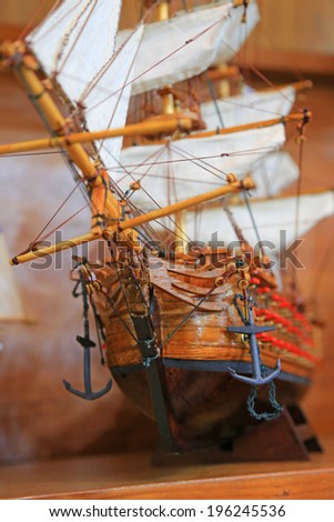 Wooden model ship with sails