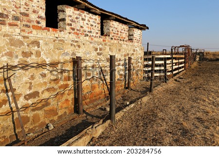 Farm shed with old fence