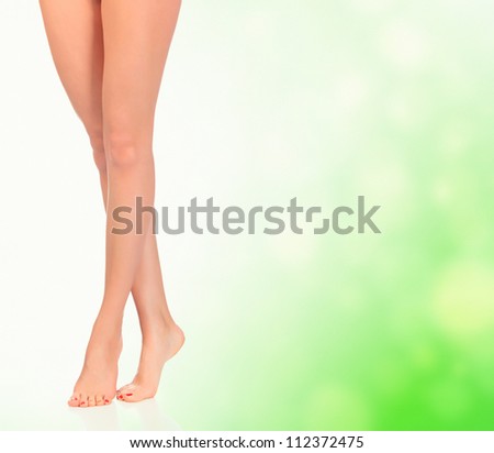 Legs of a woman against abstract background with circles and copyspace.