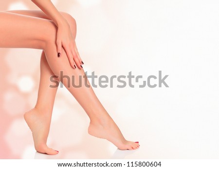 Legs of a woman against abstract background with copyspace Legs of a woman against abstract background with copyspace