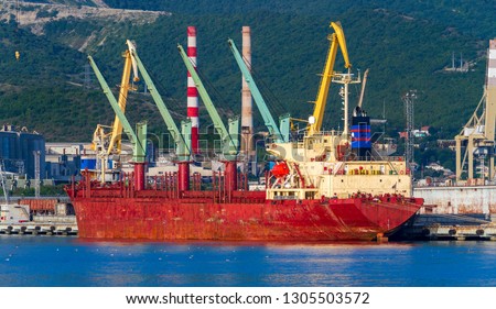 A bulk carrier in a port. Bulk freighter, or colloquially, bulker is a merchant ship specially designed to transport unpackaged bulk cargo, such as grains, coal, ore, etc in its cargo holds