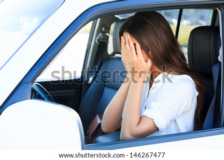 Crying woman in a car