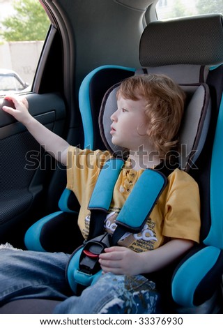 Child in a car. Traveling with comfort and safety