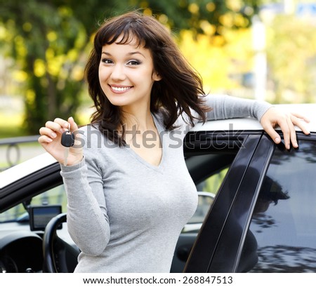 Pretty girl showing the car key