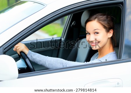 Cute girl in a car smiling