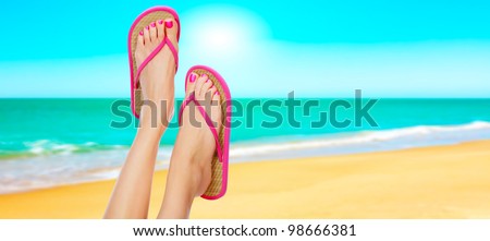 Pink sandals on woman legs. Summer time concept