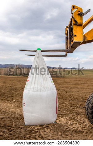 The bags with fertilizers inside used in fertilizing action in spring time