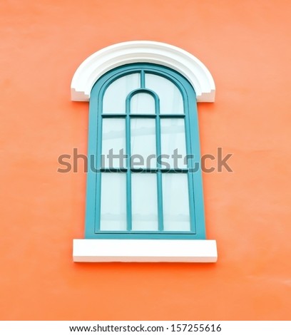 Window green on orange wall