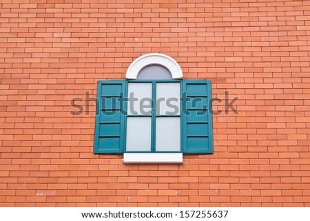 Window green on Brick wall