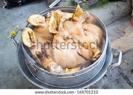 steamed pig head on boiler of thai