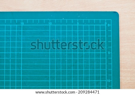 cutting rubber mat on wood table